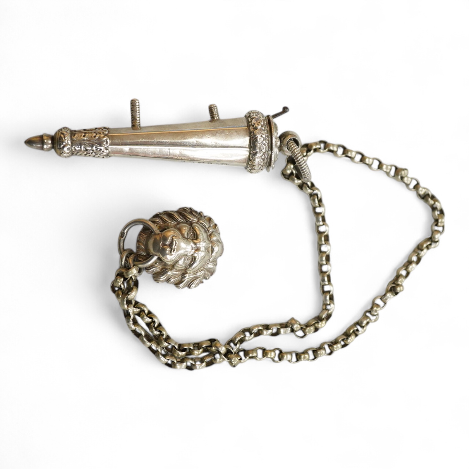 A Victorian silver whistle and case by George Unite, Birmingham, 1860, 93mm, suspended from a white metal chain with lion mask mount.